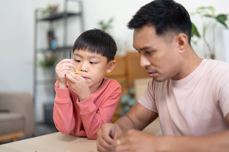Activity of son and father constructing science models together