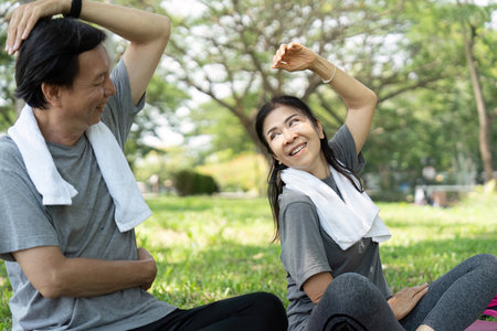 Wellness and yoga stretches for a happy seniors couple outdoorsの写真素材