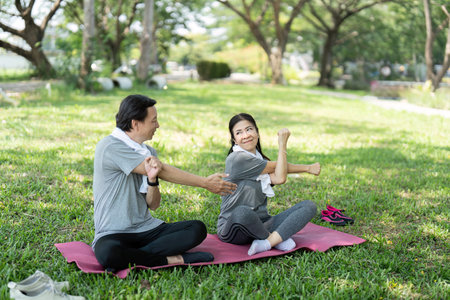 Wellness stretching: Seniors couple enjoying yoga practiceの写真素材