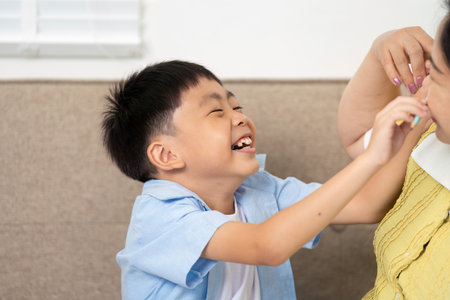 Back to School. Happy child playing with mother at home.の写真素材