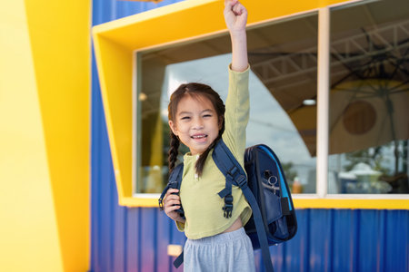 Back to School: Girl Celebrating New Beginningsの写真素材