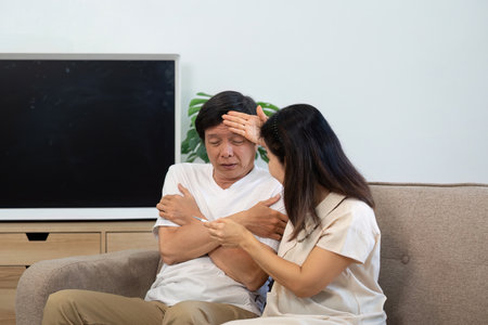 Wellness and Support. Elderly couple comforting each other during health concerns.の写真素材