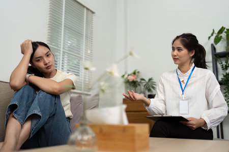 Psychologist discussing emotional issues with a patient in therapy