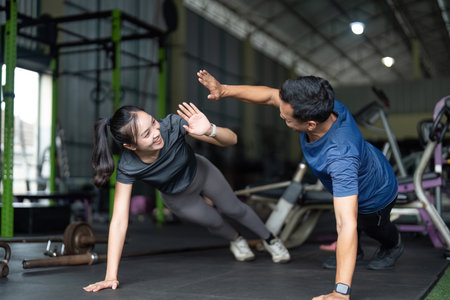 Wellness and Friendship. Friends having fun during a workout session at the gym.