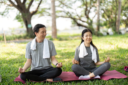 Couple Meditating Together in a Peaceful Outdoor Setting. Mindfulness Practice.の写真素材