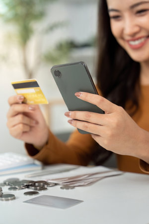 Digital Banking. Happy woman shopping online with credit card and smartphone.