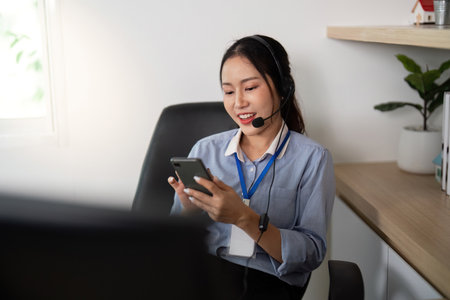 Remote Work and Customer Engagement. Woman using smartphone while providing support in a virtual...