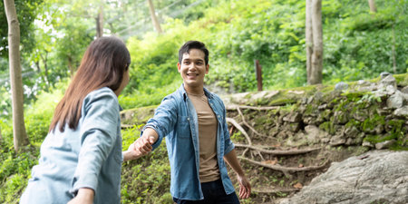 Couple Holding Hands in Nature. Connection and joy in the outdoors.の写真素材