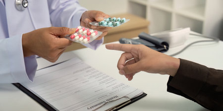 Medication Selection. Doctor presenting different medication options to patient.の写真素材