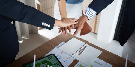 Team Collaboration: Hands Together for ESG Commitment