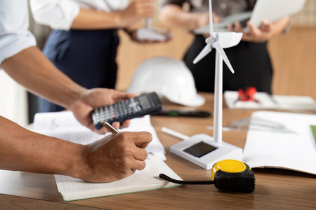 Sustainability Documentation. Professional calculating eco-friendly project metrics.の写真素材