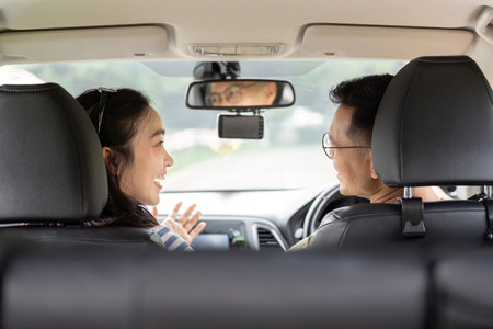 Couple enjoying a joyful conversation in a car