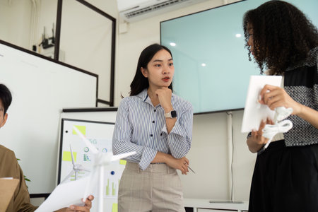 Sustainability Focus: Engaging Team Meeting on Eco-Friendly Solutionsの写真素材