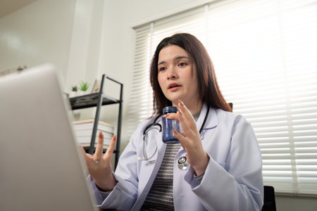 Telemedicine Consultation. Doctor advising patient via video call with medication.