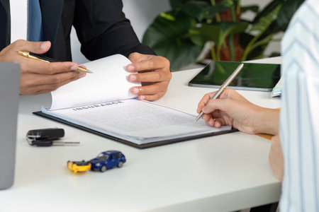 Insurance Consultation. Client discussing car insurance options with an agent.