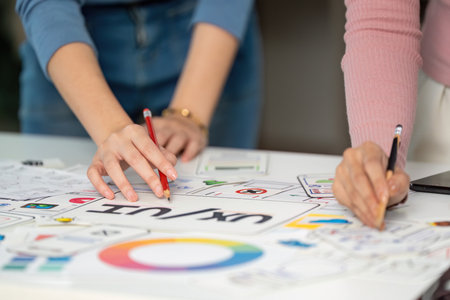 UX and UI Design Collaboration. Creative team brainstorming on user interface concepts.の写真素材