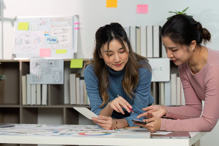 UX and UI Design Discussion with Sketches and Smartphoneの写真素材