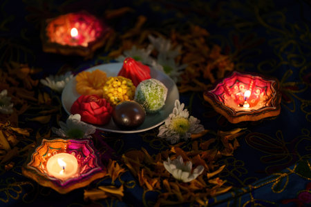 Diwali Festivities: Traditional Sweets and Diyas on Tableの写真素材