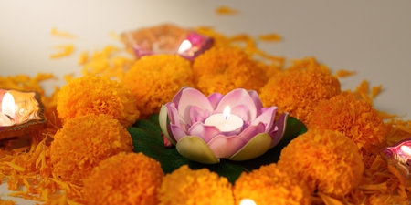Lotus Flower Candle. A beautiful lotus candle surrounded by marigold flowers for Diwali.の写真素材