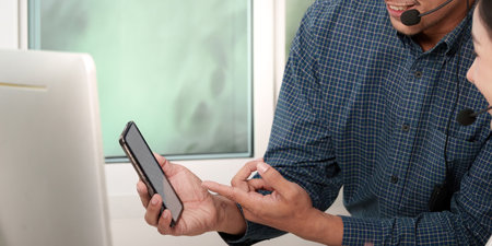 Call Center Agents Discussing Customer Solutions via Smartphone