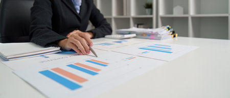 Data Visualization. Analyst interpreting financial graphs and data.の写真素材