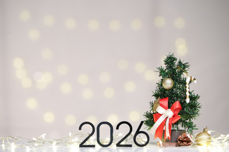 Festive Decor. Mini Christmas tree and 2026 for holiday spirit.