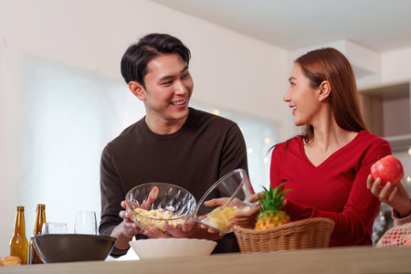 Happy New Year Celebration with Friends at Homeの写真素材