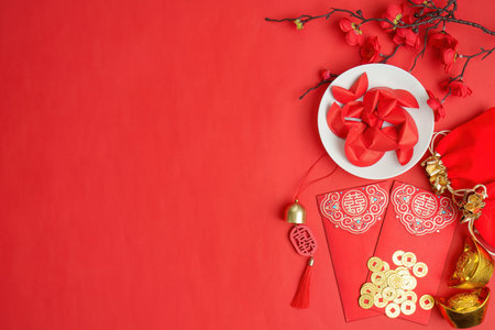 Chinese New Year decorations with red envelopes and gold coinsの写真素材