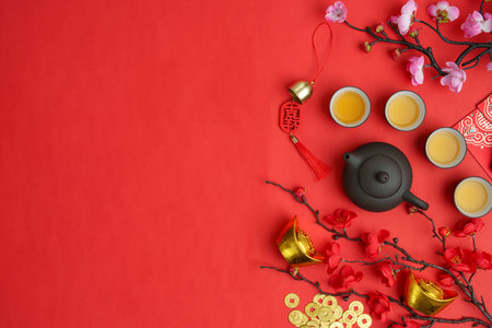 Chinese New Year celebration with tea set and decorationsの写真素材