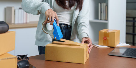Sealing Packages with Tape for Secure Shipping