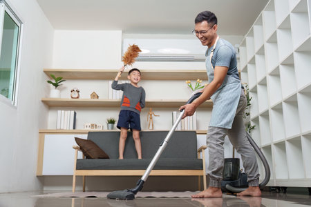 Joyful cleaning session between father and son, embracing teamwork