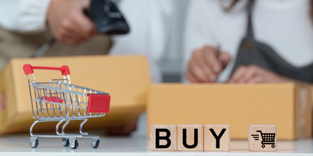 E-commerce shopping concept. Buy online with shopping cart and purchase boxes.の写真素材