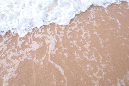 soft wave of the sea on the sand beach, close-up