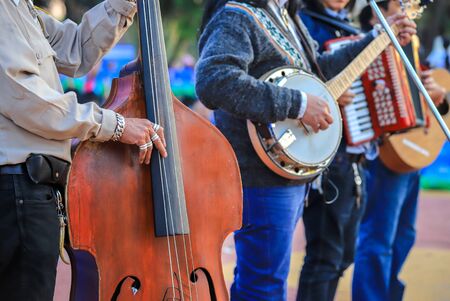musicians man playing guitar and banjo at city square for the tourists and citizens.の写真素材