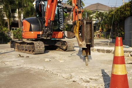 Drilling car machine working on road.の写真素材