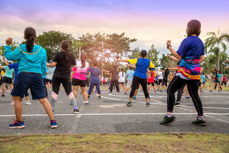 Chiang Mai, THAILAND - July 11: People doing aerobic dance after work for exercise at Royal Park on July 11, 2019 in Chiang Mai, Thailand.のeditorial素材