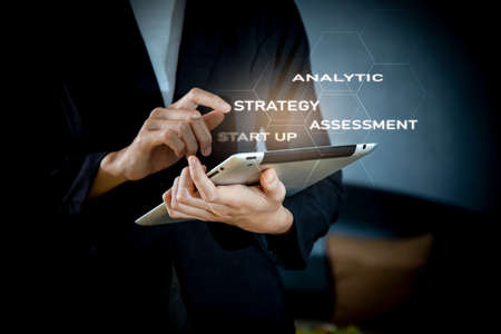 Business, Technology, Internet and network concept. Young businessman working on the tablet of the future,の写真素材