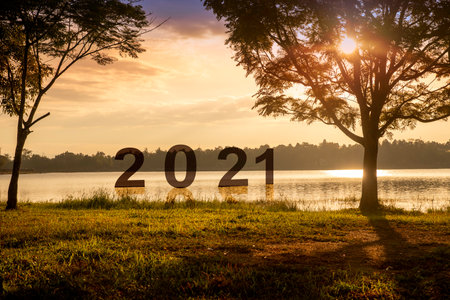 New year concept. Number 2021 in lake on sunset or sunrise in  autumn with beautiful landscape. holiday conceptの写真素材