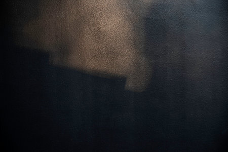 Sunlight and shadow on black grey and grunge concrete cement wallの写真素材