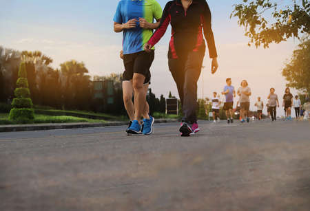 Group of people exercise walking, joging in the park in morning. healthy conceptの写真素材