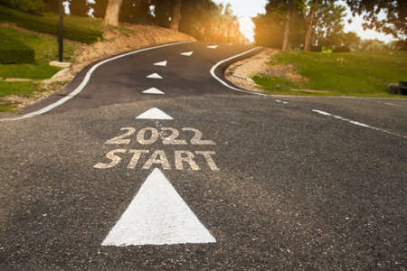 Start 2022 written on  road in the middle of empty asphalt road .. Concept for vision new year 2022.の写真素材