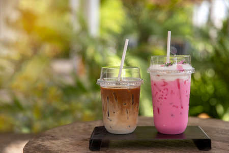 ice coffee and milk shake on blurred nature background. relaxatuon conceptの写真素材