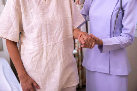 Gently trained nurses help adult patients.. healthy conceptの写真素材
