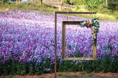 Photo frame mock up with space for photo  and beautiful  flowers background..imageの写真素材