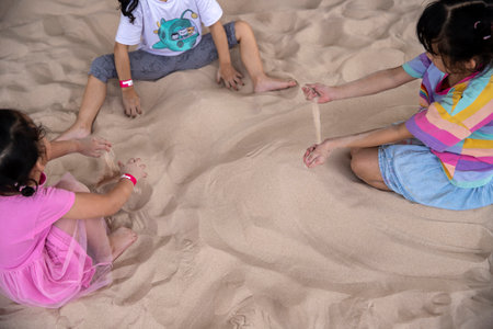 children playing with sand on summer holidays. imageの写真素材
