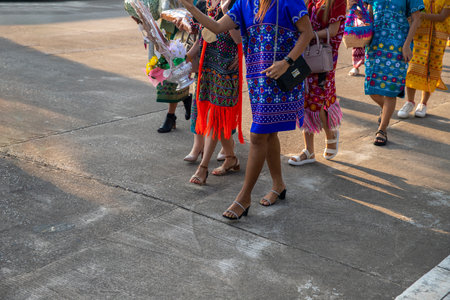 group of tribal women are walking to charity.. image