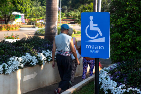 Wheelchair sign on concrete ramp in public parkの写真素材
