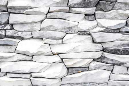 Background of stone wall texture. Modern style design decorative uneven cracked surface.の写真素材