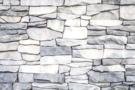 pattern of modern style design decorative uneven cracked real stone wall surface with cementの写真素材