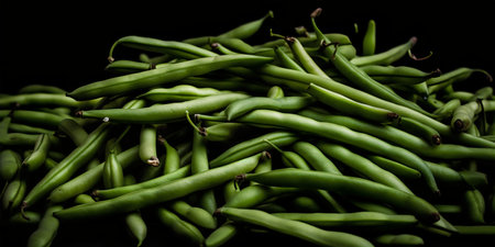 Green beans on a black background. Close up. Selective focus.の写真素材